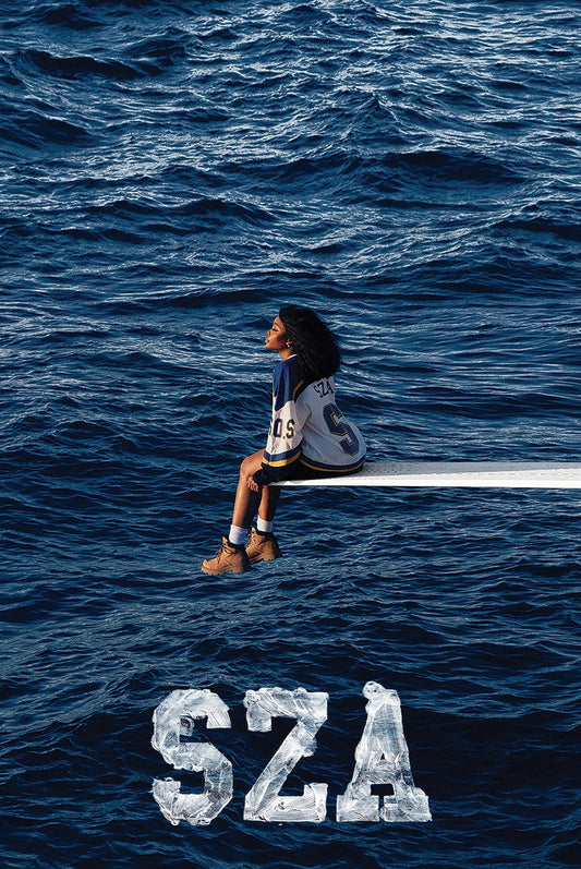 SZA SOS poster featuring SZA seated on a diving board above the ocean