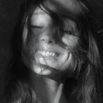 Ariana Grande – Petals poster featuring a black-and-white close-up portrait of Ariana Grande