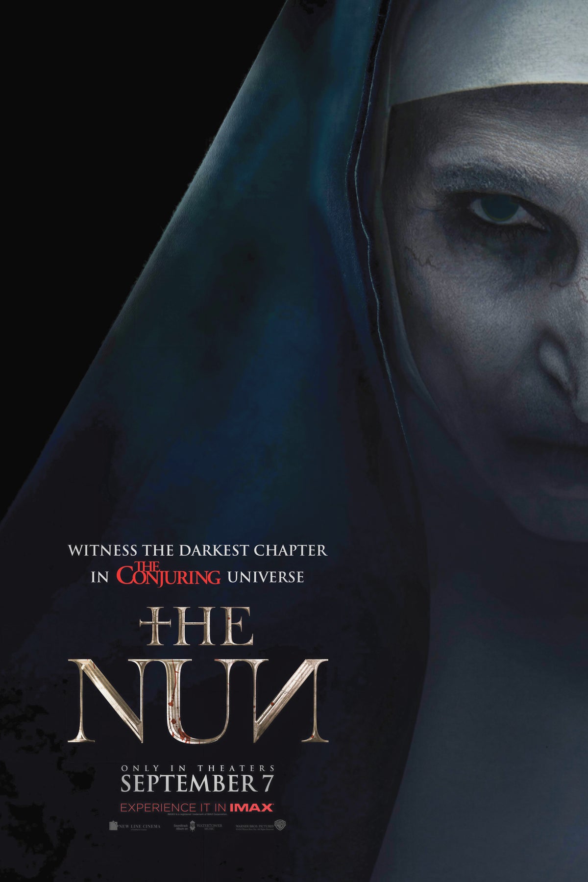 The Nun poster featuring a shadowed close-up face above The Nun film title